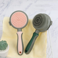 Two pet grooming brushes on a yellow towel with a marble background
