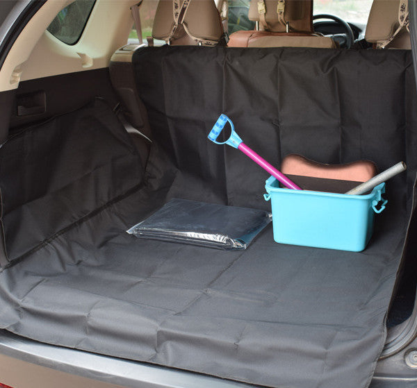 Durable travel mat for dogs spread out in car trunk with cleaning tools and storage box