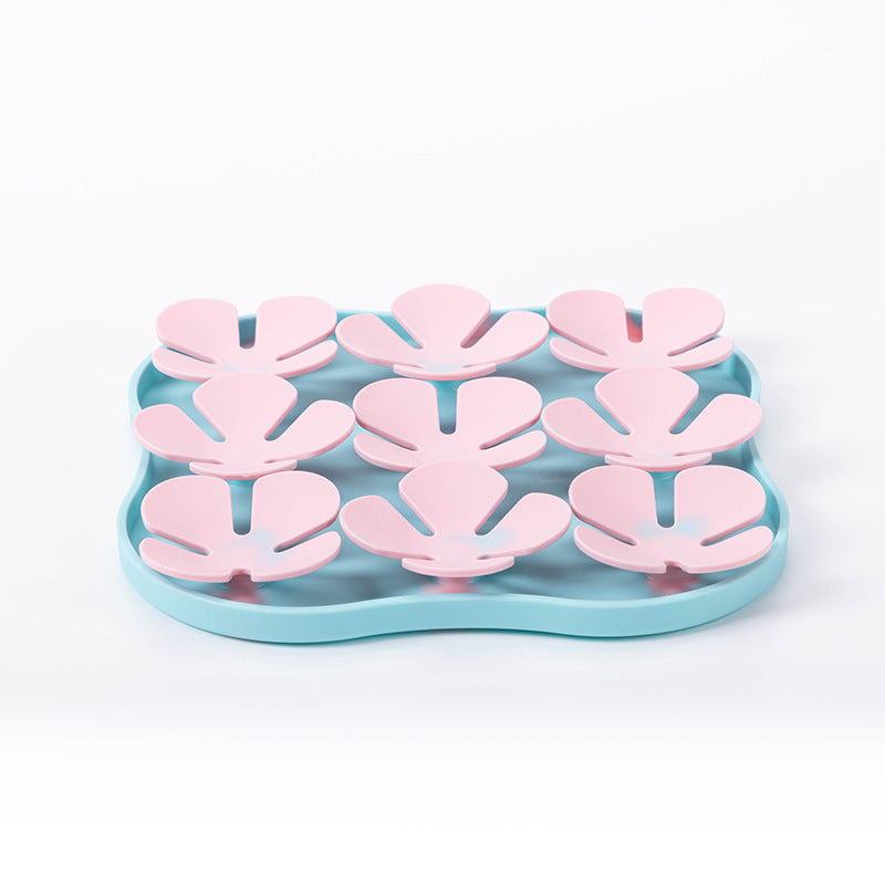 Furfamilyclub Eating Pet Calming Mat with blue base and pink slow feeder petals for pet comfort