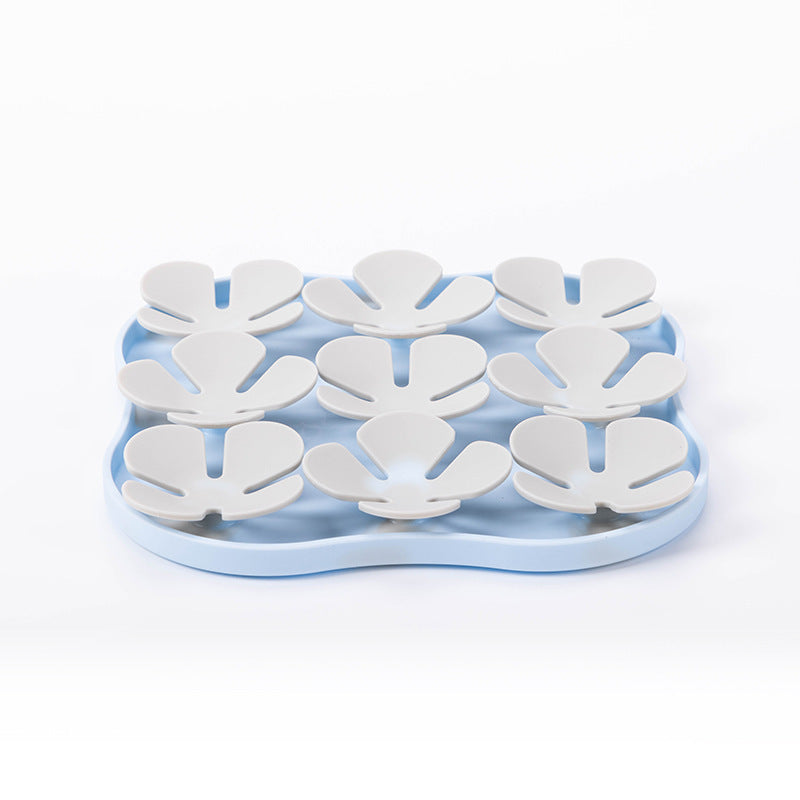 Furfamilyclub Eating Pet Calming Mat in blue with white paw-shaped feeding sections for slow pet eating