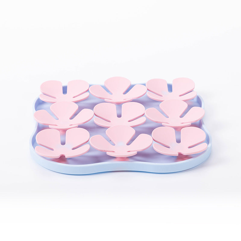 Furfamilyclub Eating Pet Calming Mat with pink paw-shaped sections on blue base for pet comfort