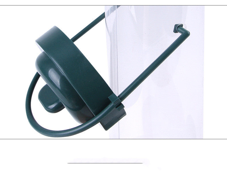 Close-up of black plastic Pet Bird Feeder Feed Station with perch and feeding ports on clear tube