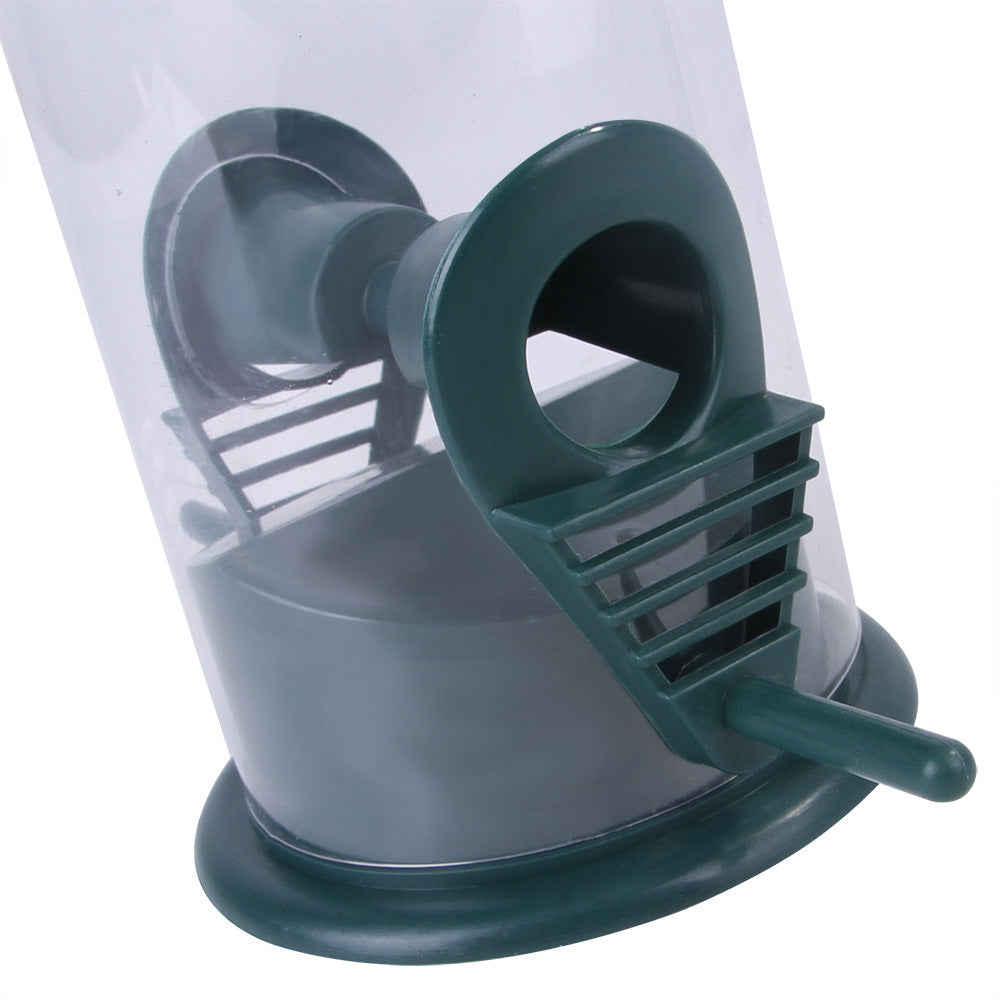 Close-up of green Pet Bird Feeder Feed Station with perch and clear seed container for pet birds