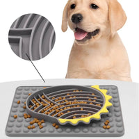 Furfamilyclub Slow Feeder Dog Bowls in gray and yellow on a mat with a happy Labrador puppy