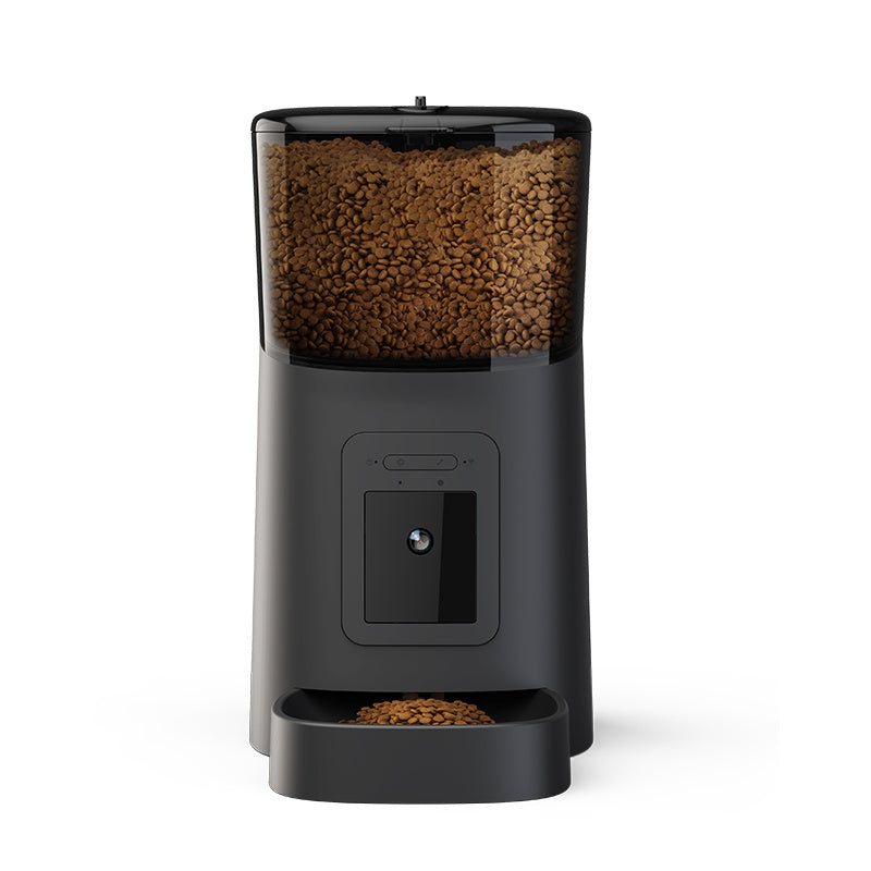 Black automatic pet feeder with camera dispensing dry pet food into a bowl for pet comfort