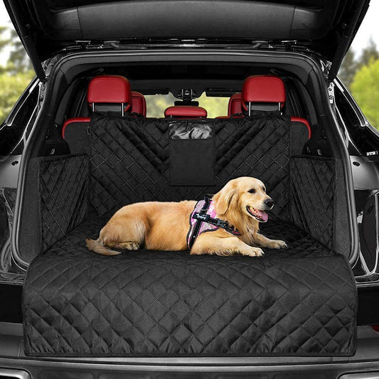 Golden retriever lying on a durable travel mat for dogs in the back of a black SUV with red seats
